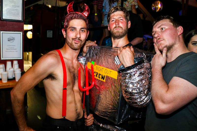 3 men in Halloween costume at pub crawl party in Queenstown