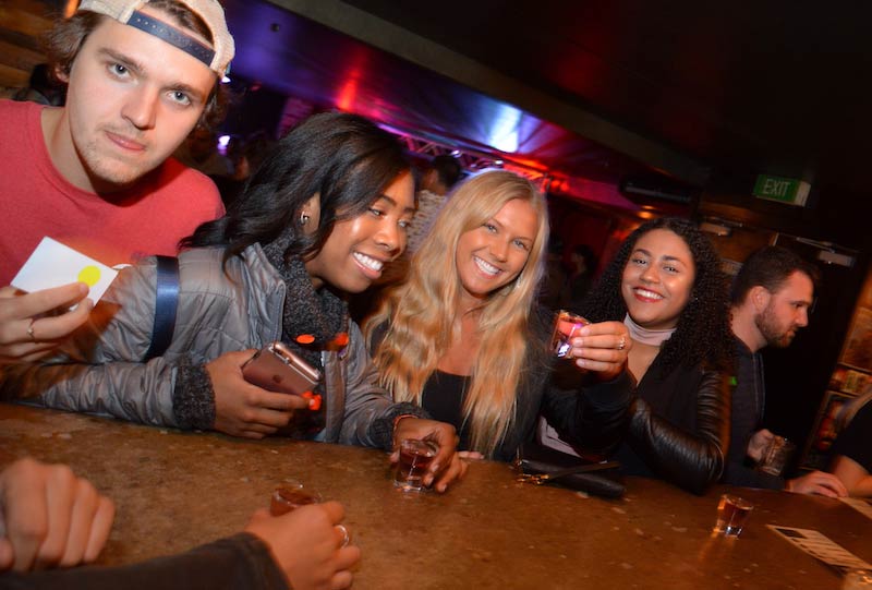 Girls drinking shots at a bar in Queenstown