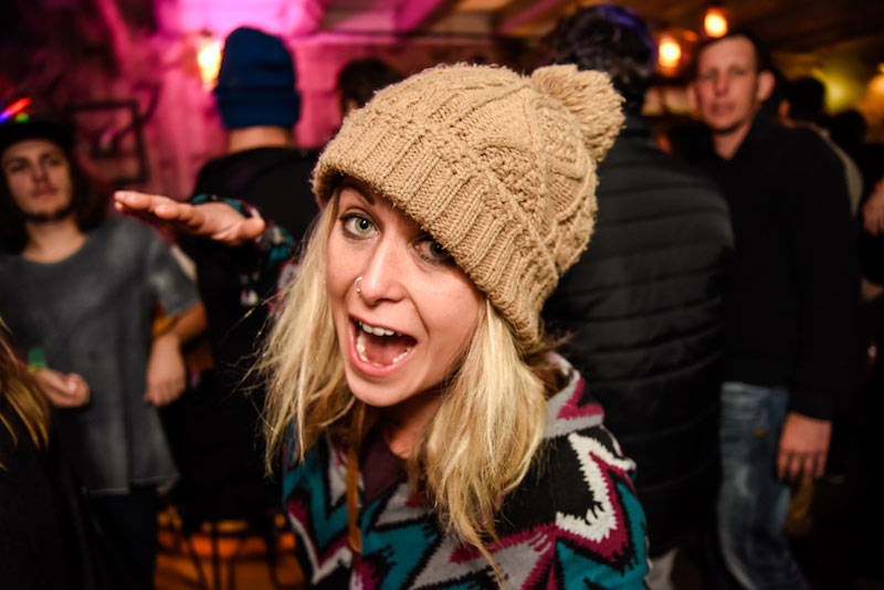 A young woman wearing a beanie on the wild bar tour during Winterfest