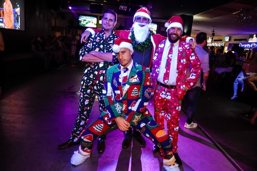 lads on 12 pubs of Christmas in their festive Christmas suits in Queenstown bar