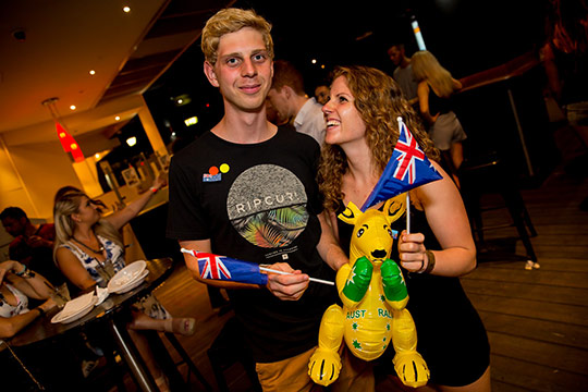 A couple partying on the Australia day weekend on the big night out pub crawl in Queenstown New Zealand