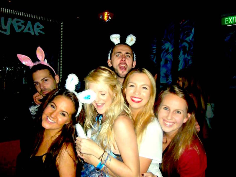 Group of party goers with bunny ears on around Easter time