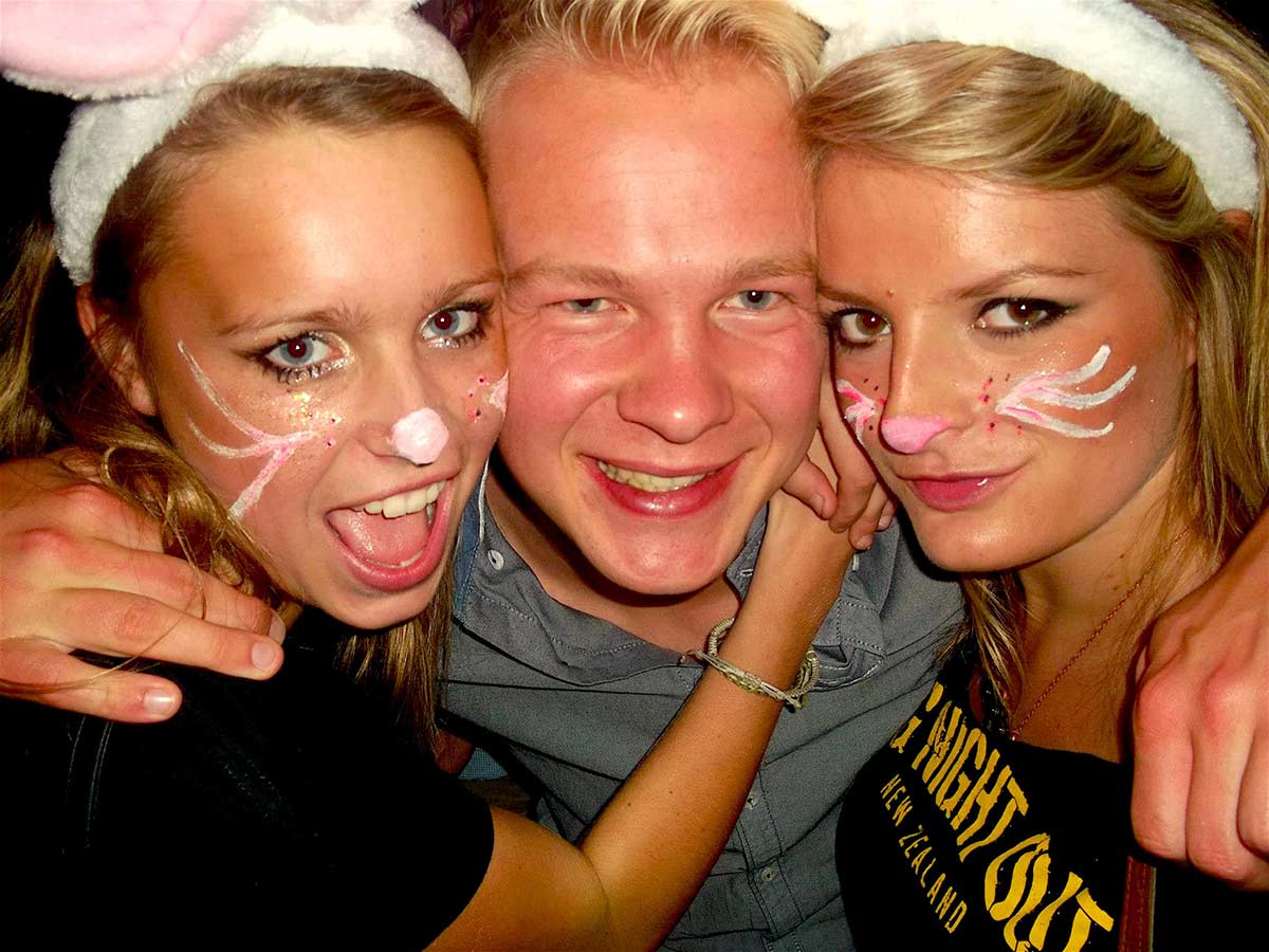 Lucky man with two playboy bunny looking girls on Big Night Out pub crawl