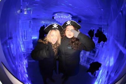 Two girls in a Queenstown ice bar with pirate hats on with the Big Night Out Pub Crawl on a Friday night