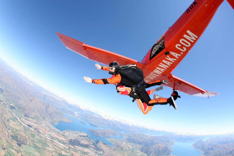 action shot of sky dive out of the Wanaka plane in Queenstown New Zealand South Island