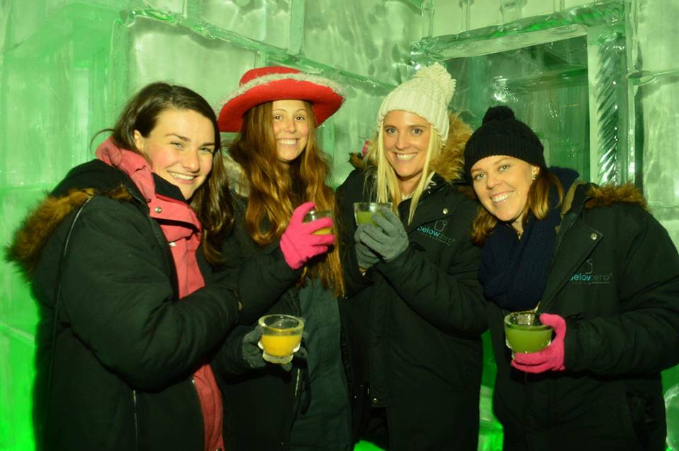 Girls having a drink at the below zero ice bar in Queenstown with the big night out pub crawl