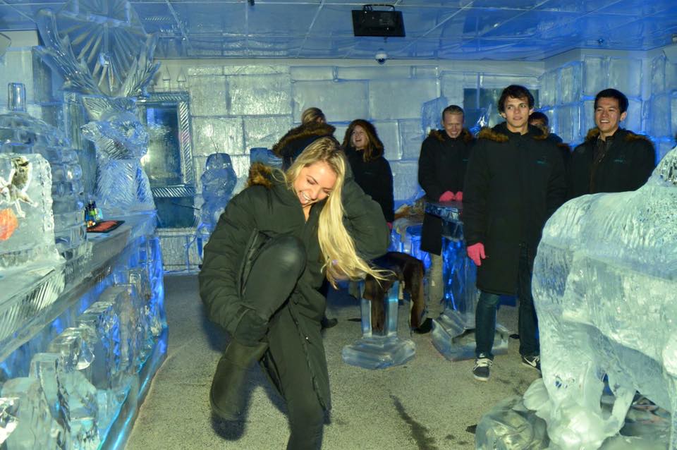 Girl dancing during big night out pub crawl in Queenstown at the Below Zero Ice Bar