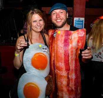 Couple on the Big Night Out pub crawl in weird bacon and egg Halloween costumes for Halloween party tour in Queenstown New Zealand