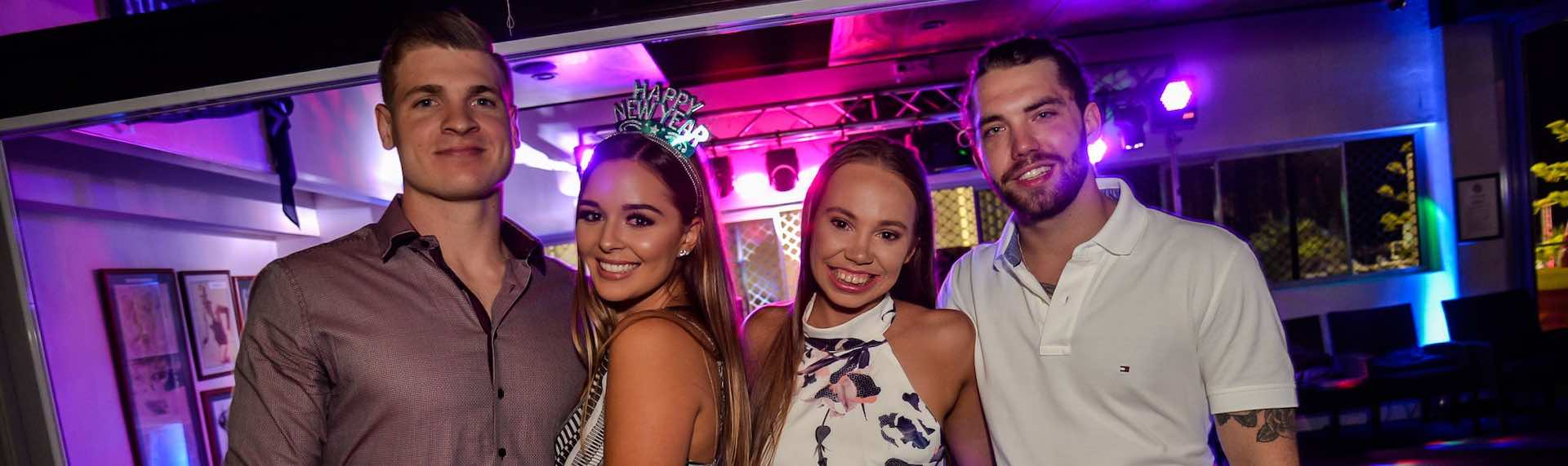 two couples celebrating new years eve with the big night out pub crawl in Queenstown