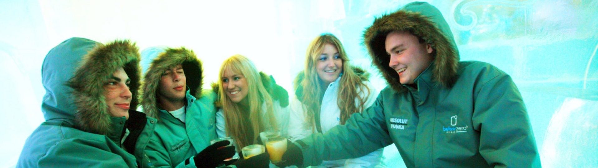 Group drinking from ice glasses at the below zero ice bar in Queenstown on friday night big night out pub crawl